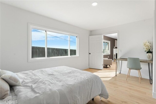 bedroom featuring light wood-style flooring and recessed lighting