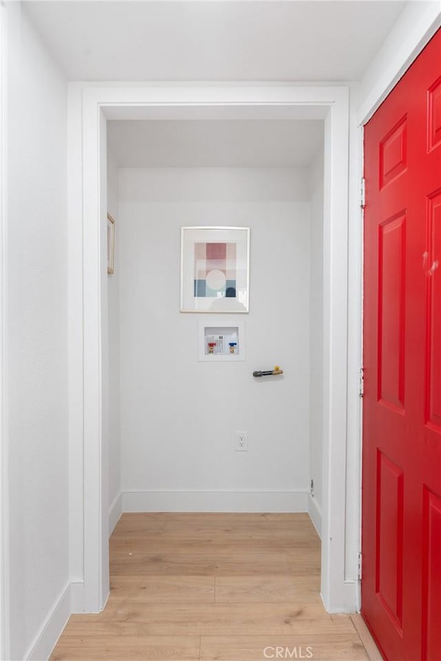 laundry room with laundry area, baseboards, hookup for a washing machine, light wood-style floors, and electric dryer hookup