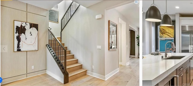 interior space with recessed lighting, baseboards, and wood finished floors