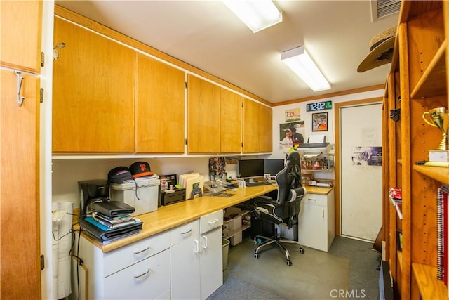 home office featuring visible vents and built in desk