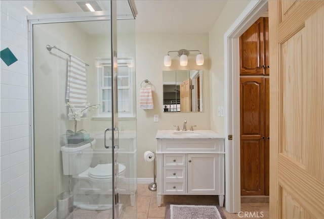 full bath featuring tile patterned flooring, toilet, vanity, and a shower stall