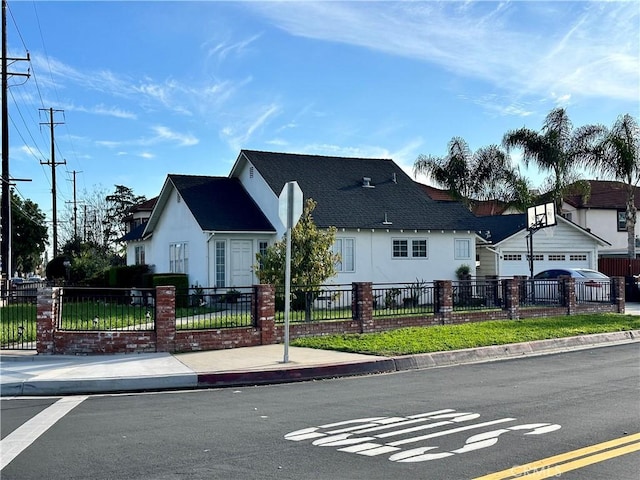 view of front of house featuring a fenced front yard and stucco siding