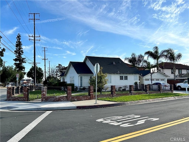 view of road featuring curbs, sidewalks, a residential view, and traffic signs