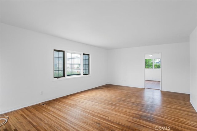 empty room with wood finished floors
