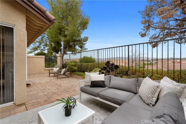 view of patio / terrace with fence and outdoor lounge area