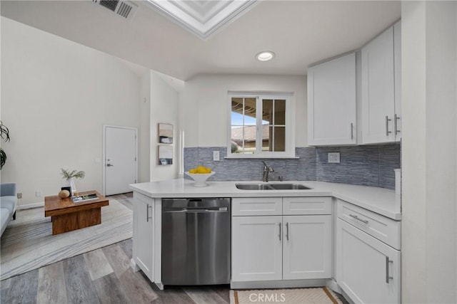 kitchen featuring a sink, visible vents, light countertops, and stainless steel dishwasher