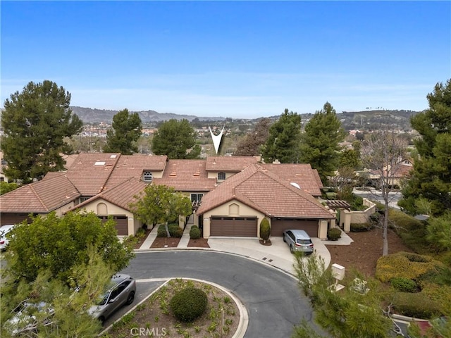 birds eye view of property featuring a mountain view