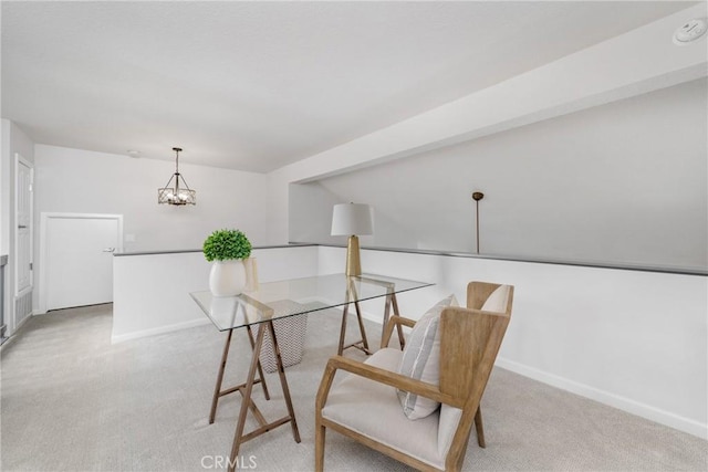 interior space with an inviting chandelier, carpet, and baseboards