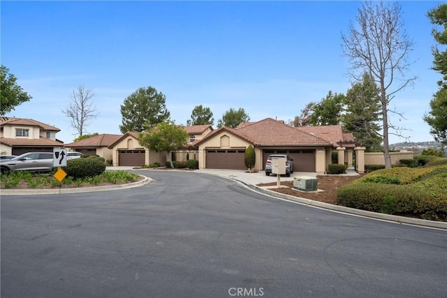 27557 Paseo Tamara, San Juan Capistrano, CA 92675 - mediterranean / spanish home featuring a tiled roof, stucco siding, driveway, and a garage