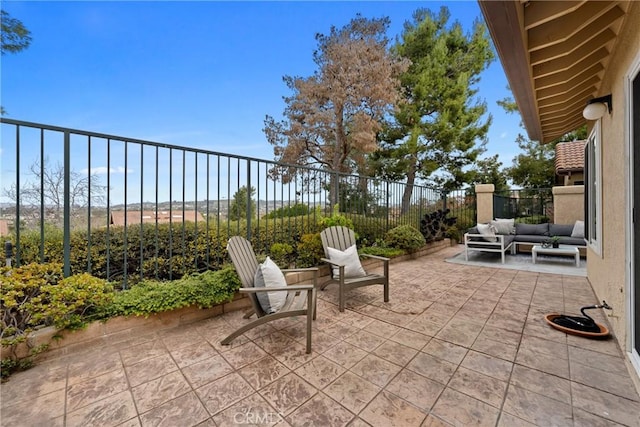 view of patio featuring fence and an outdoor living space