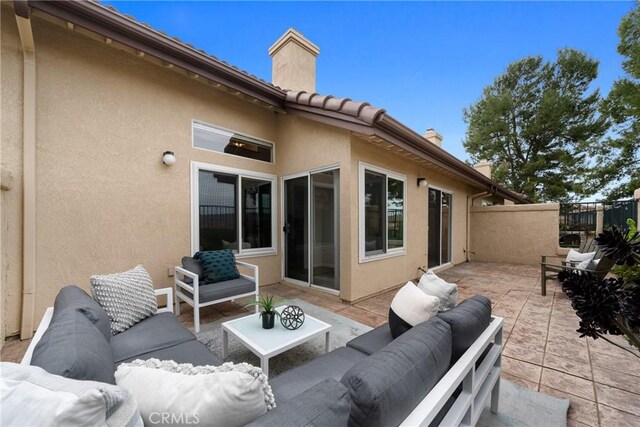 exterior space with fence and an outdoor living space