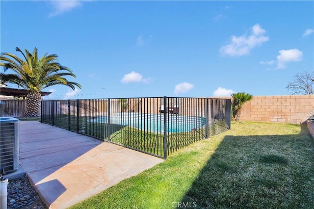 exterior space featuring a patio area, a fenced backyard, a pool, and a yard