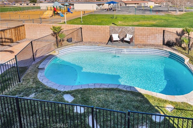 view of pool featuring a fenced backyard, a fenced in pool, a playground, and a yard