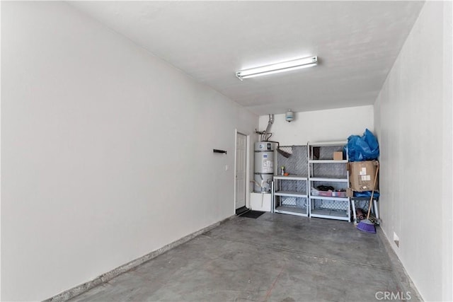 storage area featuring a garage and strapped water heater