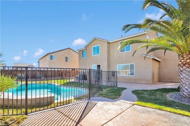 exterior space featuring a fenced in pool, a patio area, and fence