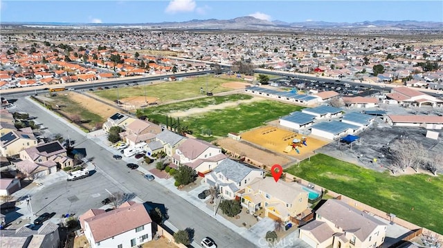 drone / aerial view featuring a residential view and a mountain view