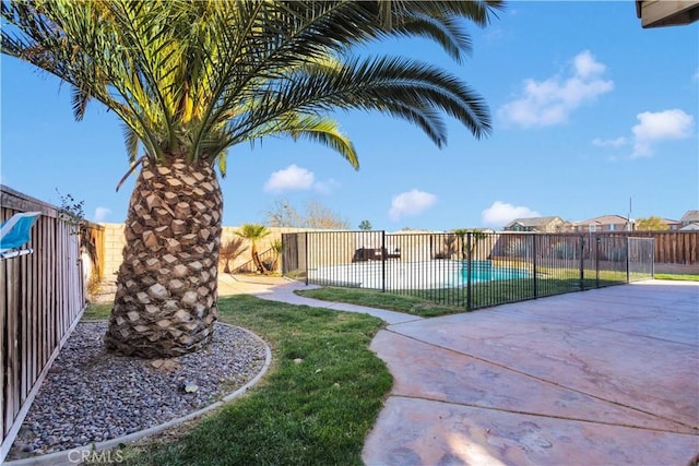 view of yard with a patio and a fenced backyard