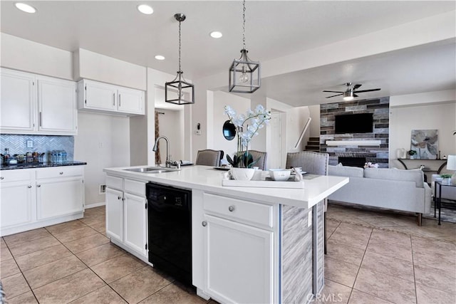 kitchen with light tile patterned floors, a sink, a ceiling fan, dishwasher, and tasteful backsplash