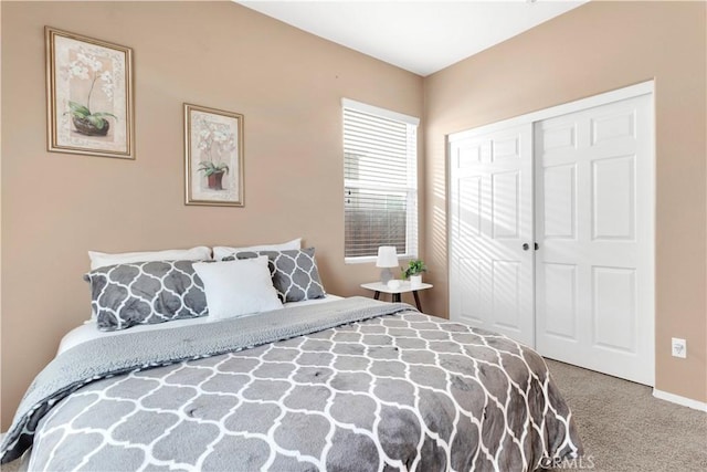 carpeted bedroom with a closet