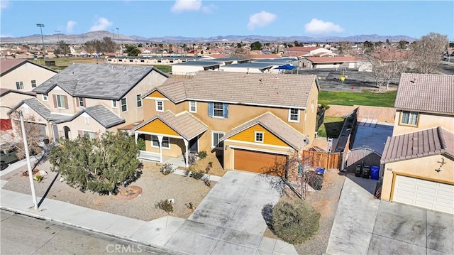 bird's eye view featuring a residential view and a mountain view