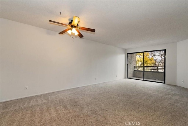 spare room with carpet floors, a textured ceiling, and a ceiling fan