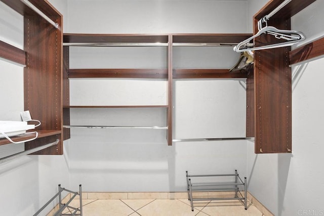 spacious closet featuring tile patterned floors