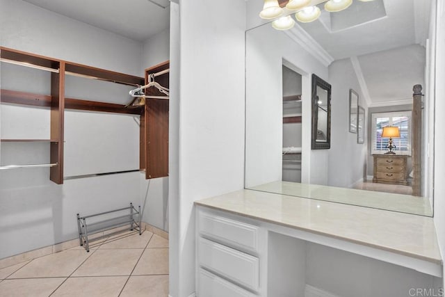 spacious closet with light tile patterned floors