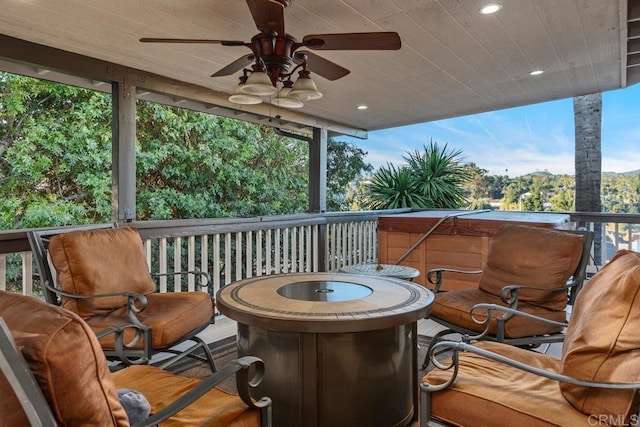 wooden deck with an outdoor fire pit