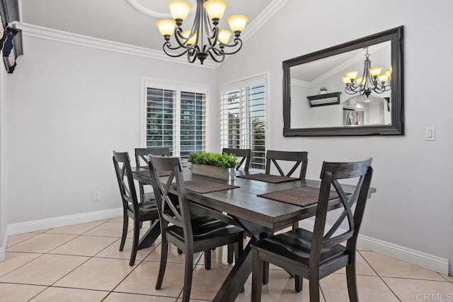 dining area featuring an inviting chandelier, baseboards, crown molding, and light tile patterned flooring