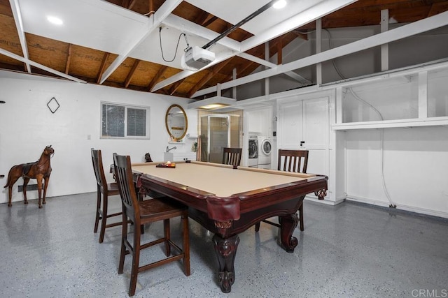 recreation room featuring lofted ceiling, pool table, dark speckled floor, and washing machine and clothes dryer