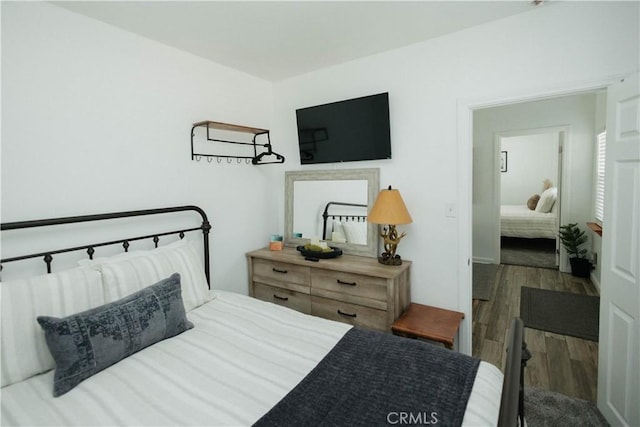 bedroom featuring wood finished floors