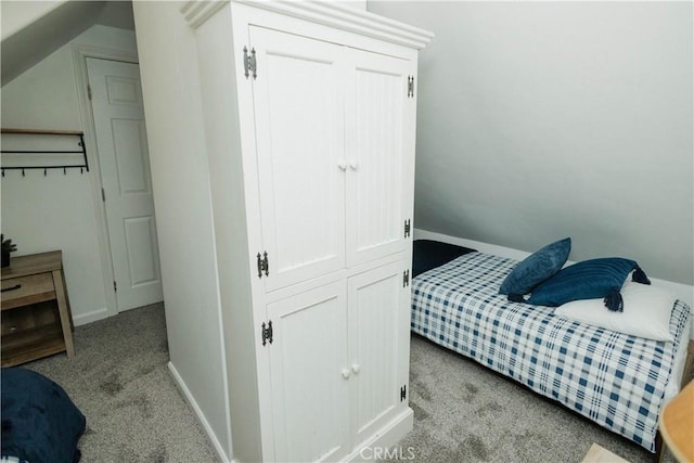 bedroom with carpet and baseboards