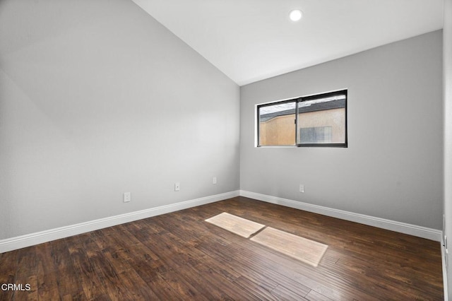 unfurnished room with dark wood-style floors, baseboards, vaulted ceiling, and recessed lighting