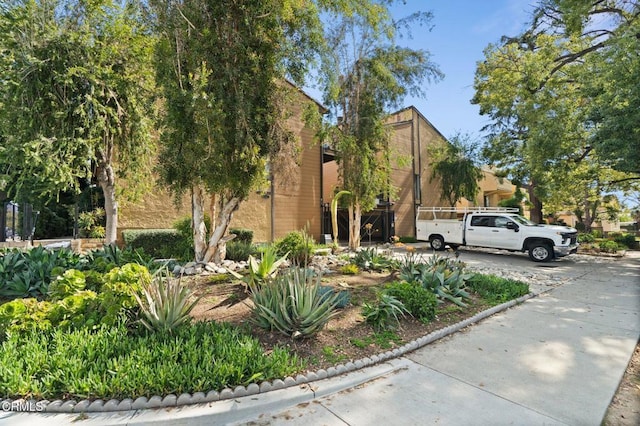 view of side of property with concrete driveway