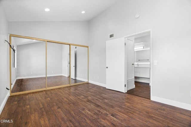 unfurnished bedroom with baseboards, visible vents, dark wood-style flooring, and recessed lighting