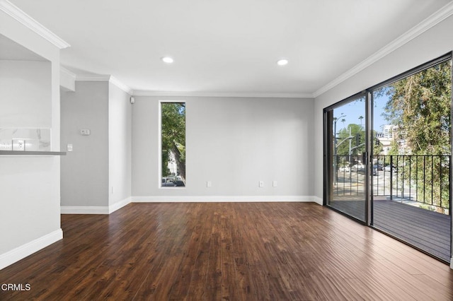 empty room with baseboards, dark wood finished floors, crown molding, and recessed lighting