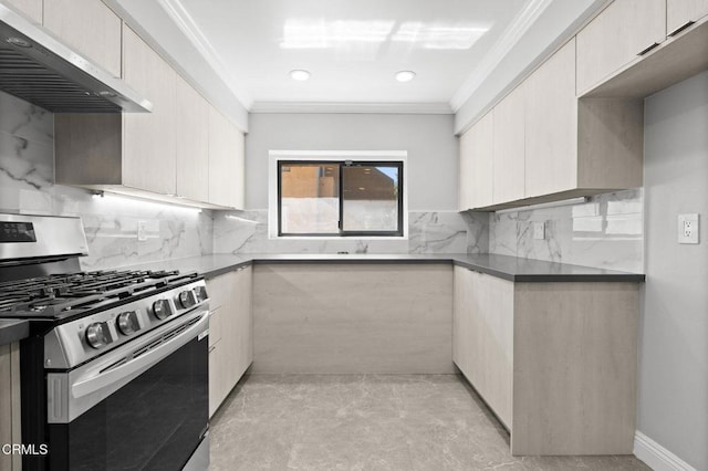 kitchen featuring ornamental molding, stainless steel gas stove, wall chimney range hood, and tasteful backsplash