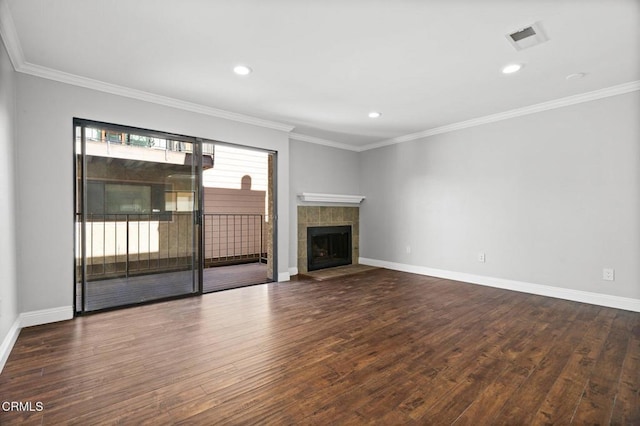 unfurnished living room featuring dark wood-style flooring, a fireplace, visible vents, and baseboards