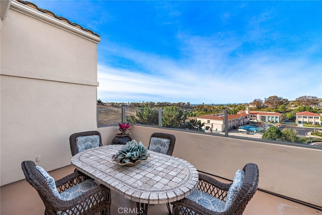 balcony with outdoor dining area