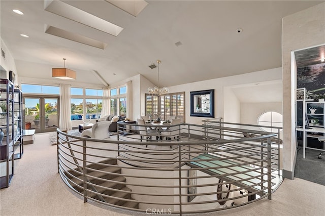 interior space with vaulted ceiling, french doors, visible vents, and recessed lighting