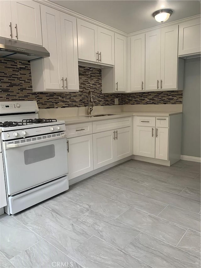 kitchen featuring under cabinet range hood, a sink, white cabinets, white range with gas cooktop, and light countertops