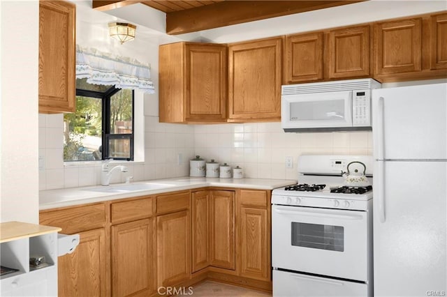 5768 Heath Creek Dr, Wrightwood, CA 92397 - kitchen featuring light countertops, white appliances, backsplash, a sink, and brown cabinets