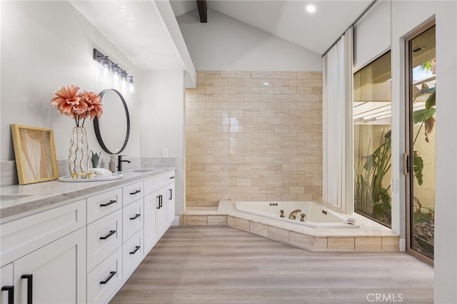 232 Kavenish Dr W, Rancho Mirage, CA 92270 - full bath featuring a bath, vaulted ceiling with beams, wood finished floors, and vanity