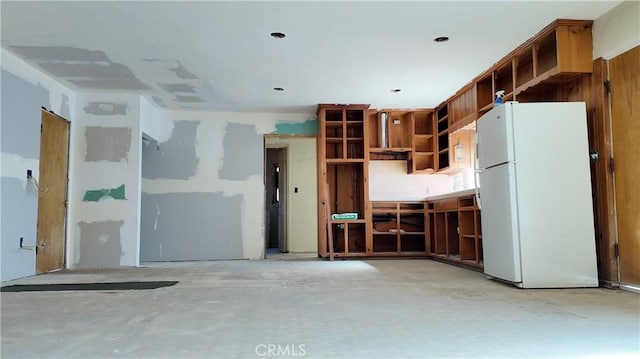 interior space with open shelves and freestanding refrigerator