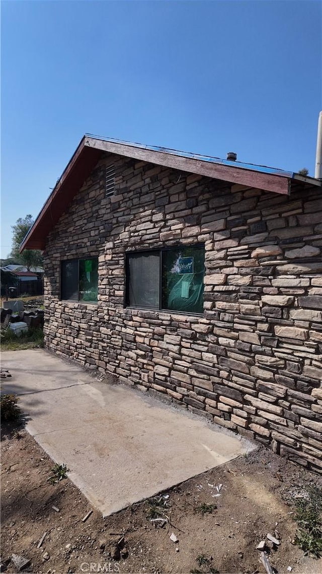 view of property exterior featuring stone siding