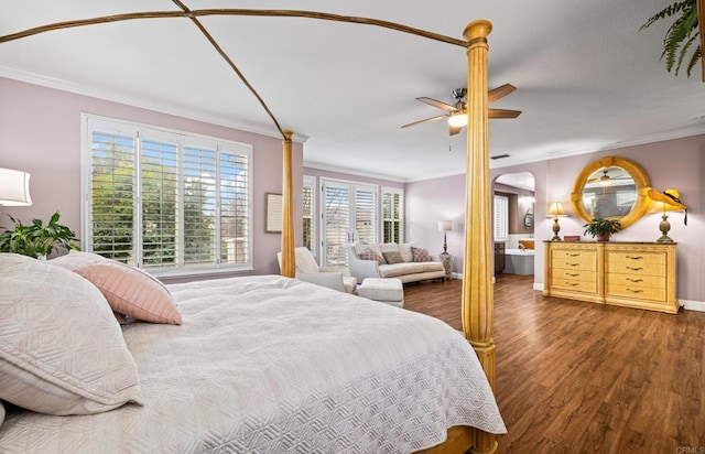 bedroom featuring ceiling fan, wood finished floors, and crown molding