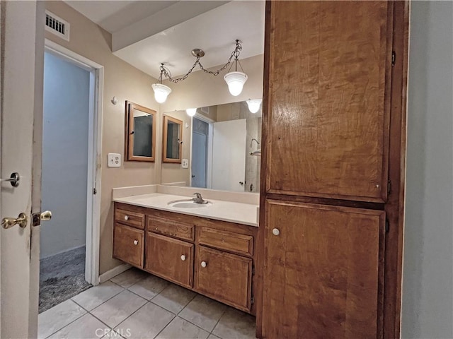 bathroom with visible vents, tile patterned flooring, and vanity