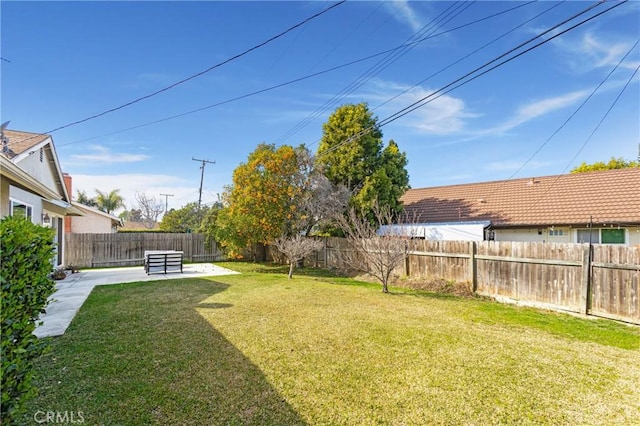 view of yard featuring a patio area and a fenced backyard