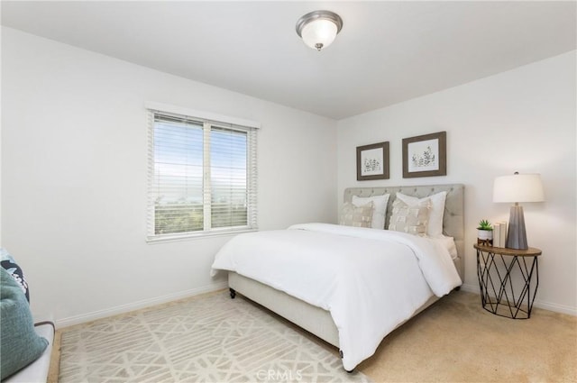 carpeted bedroom with baseboards