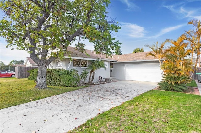 single story home with stucco siding, concrete driveway, fence, a garage, and a front lawn